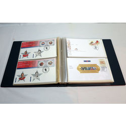 blue uni safe fdc album filled with 79 different first day covers that range from 2000 to 2002