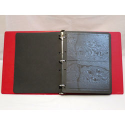 a 3 ring used red binder with 50 two pocket black pages
